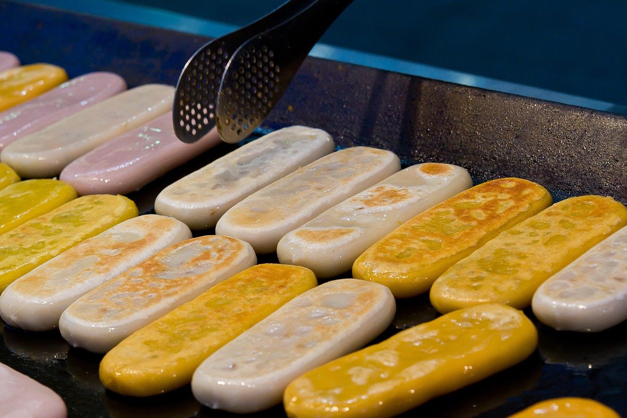 Hotteok Korean street food pancakes cooking on a griddle