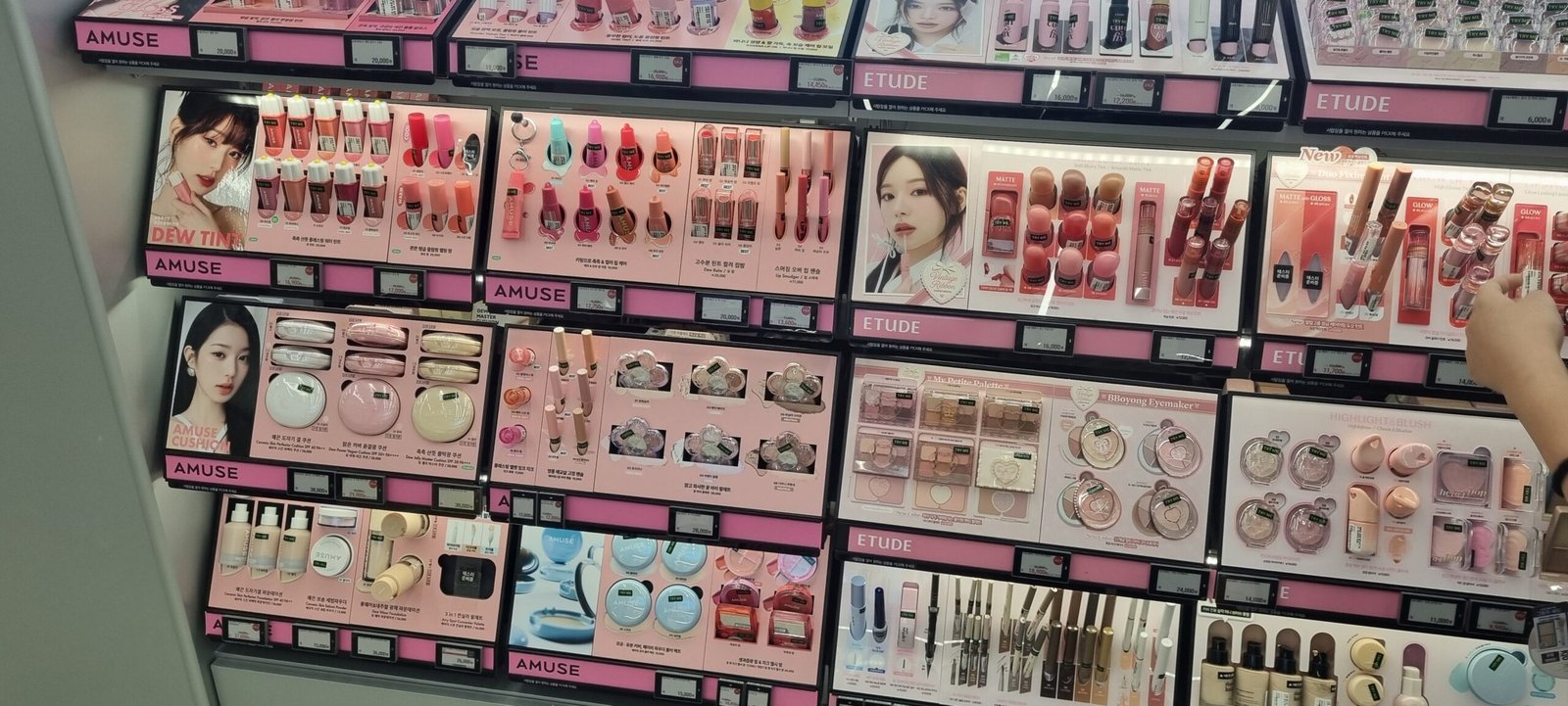 A wall of Korean cushion foundations and base makeup at Olive Young