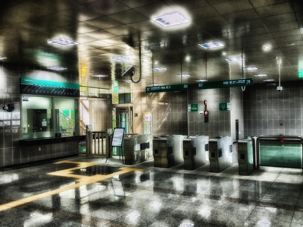 Concourse and fare gates inside a Korean subway station