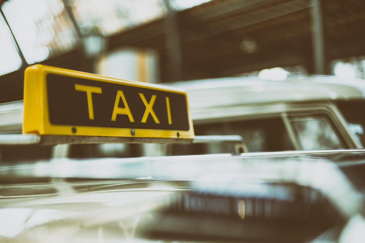 Close-up of a taxi sign on top of a car