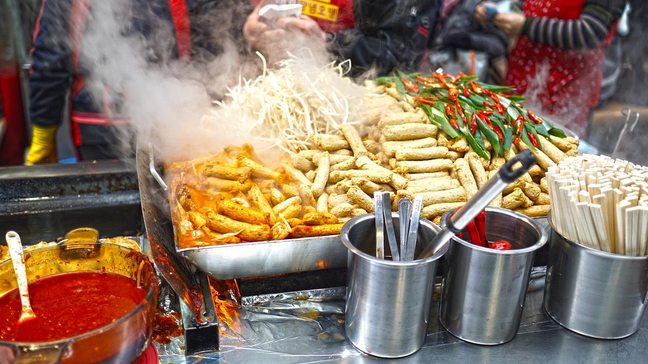 Korean street food cart selling tteokbokki and fish cake skewers
