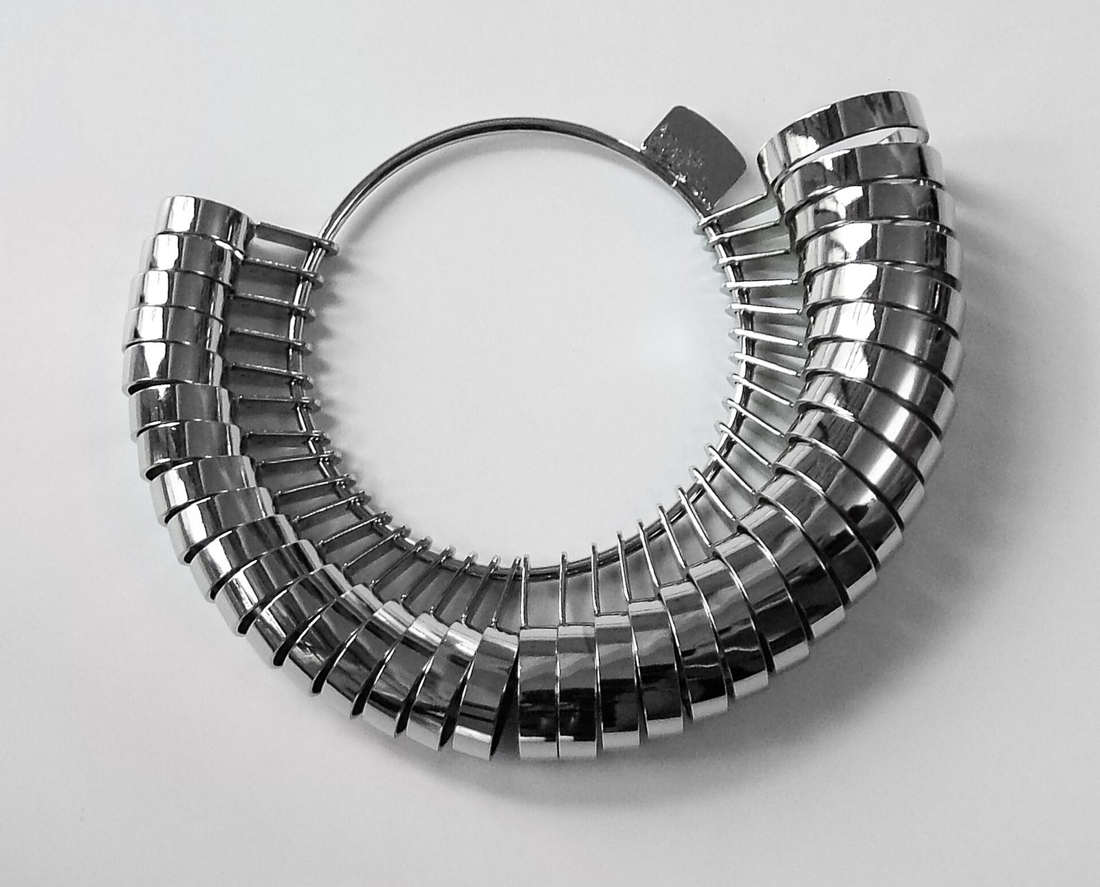 A hoop of numbered metal test rings, the ring gauge set used in jewellery shops to measure finger size